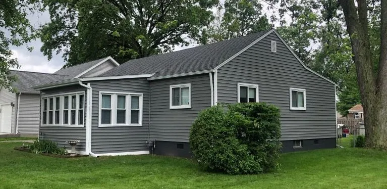 After: Storm-worn roof restored to a sound, clean finish