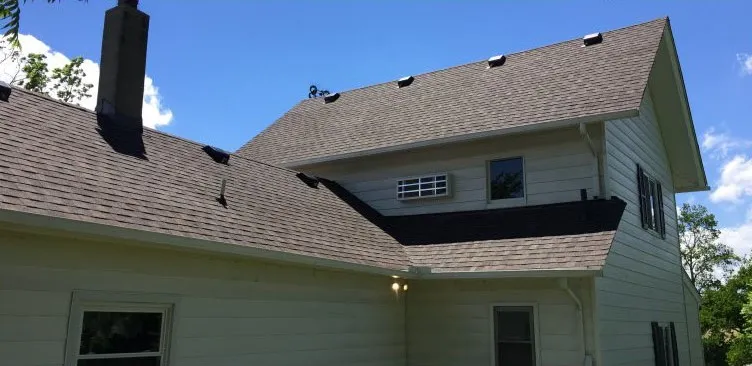 After: Tired, damaged shingles repaired and made watertight