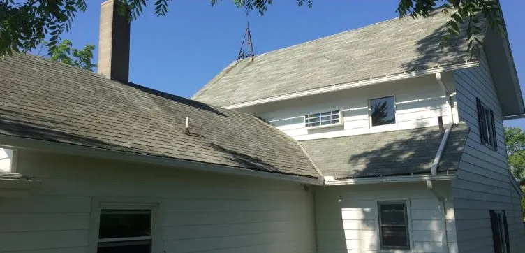 Before: Tired, damaged shingles repaired and made watertight