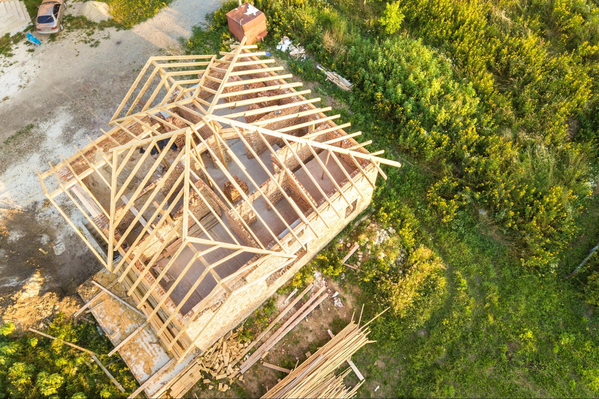 Roofing contractor repairing a house roof